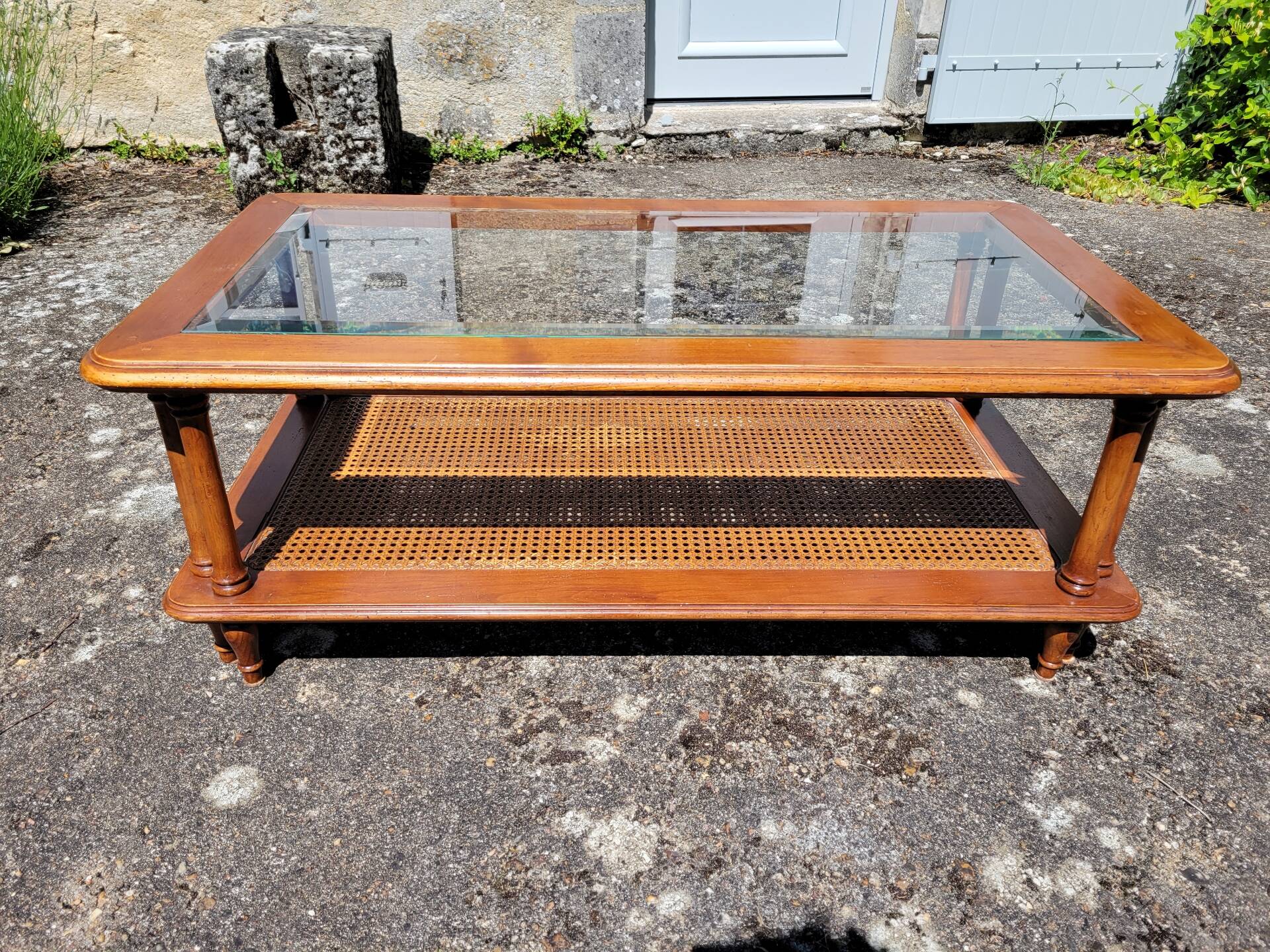 Coffee table in cherry wood, glass and caning.