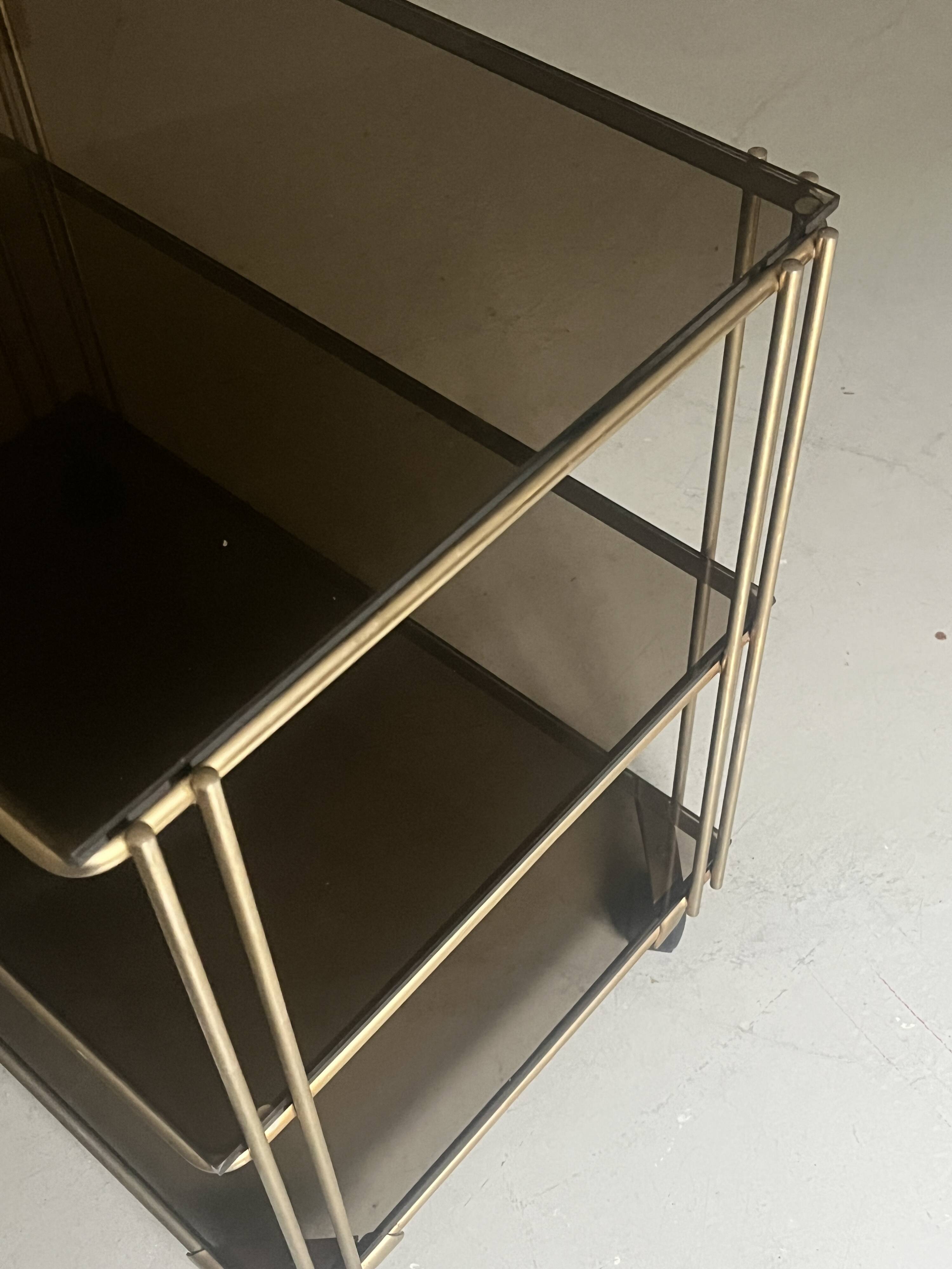 Smoked glass and brass hi-fi/TV stand, circa 1970