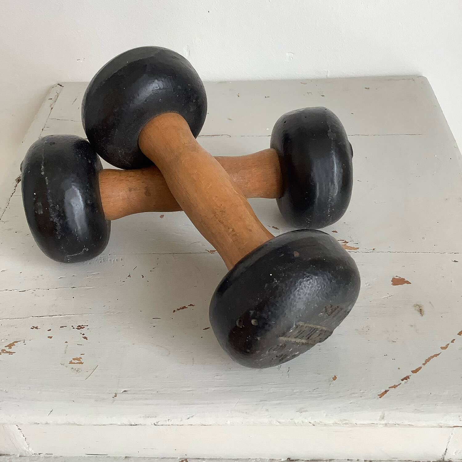 Pair of wooden and cast iron dumbbells