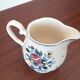 Flowery milk jug