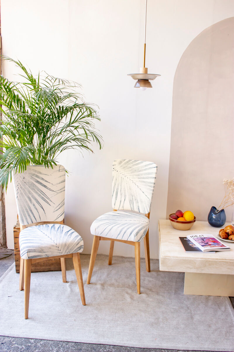 Pair of vintage chairs reupholstered with palm pattern fabric