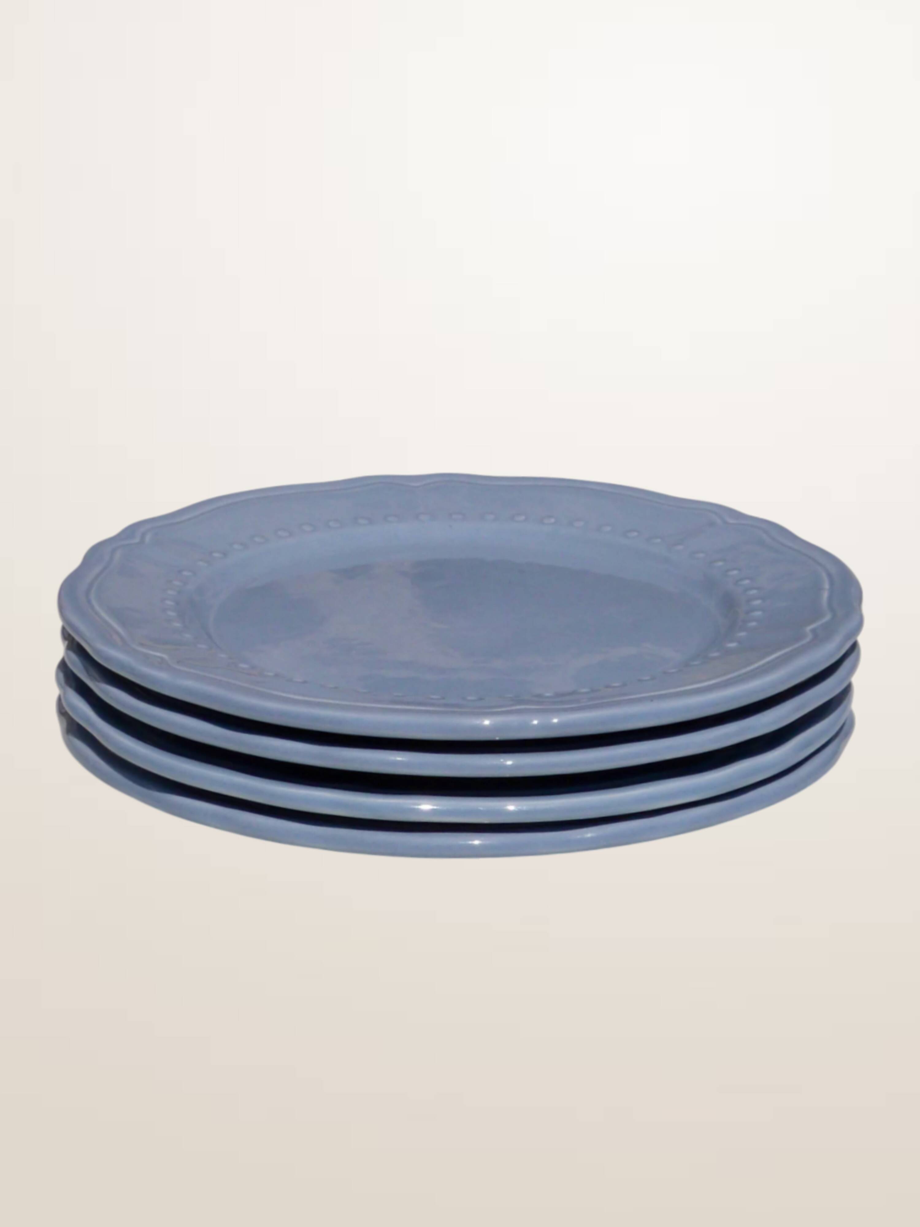 Set of 4 blue ceramic dessert plates.