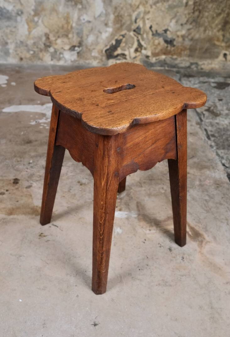 Pair of scalloped oak stools, France, early 20th century