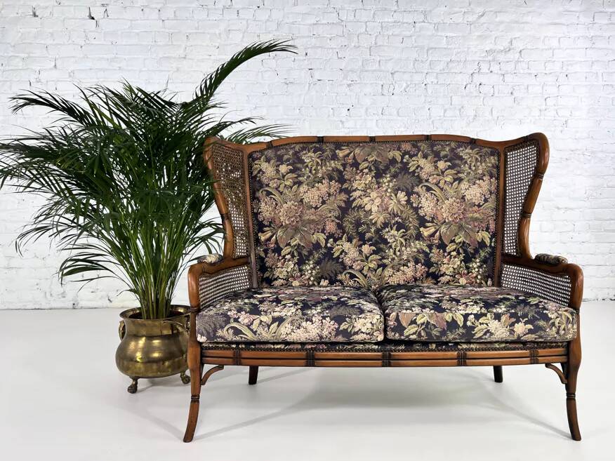 Wingback 2-seater sofa in carved wood, cane and fabric