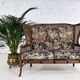 Wingback 2-seater sofa in carved wood, cane and fabric