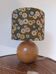 round wooden lamp, khaki lampshade with rising sun print