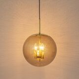 Large Limburg pendant light in brass with smoked glass ball, Germany, 1970s.