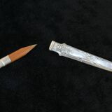 Old necessary to write 1900 in silver metal in box
