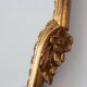 20th Century Louis XVI style giltwood mirror with ornate crest, France