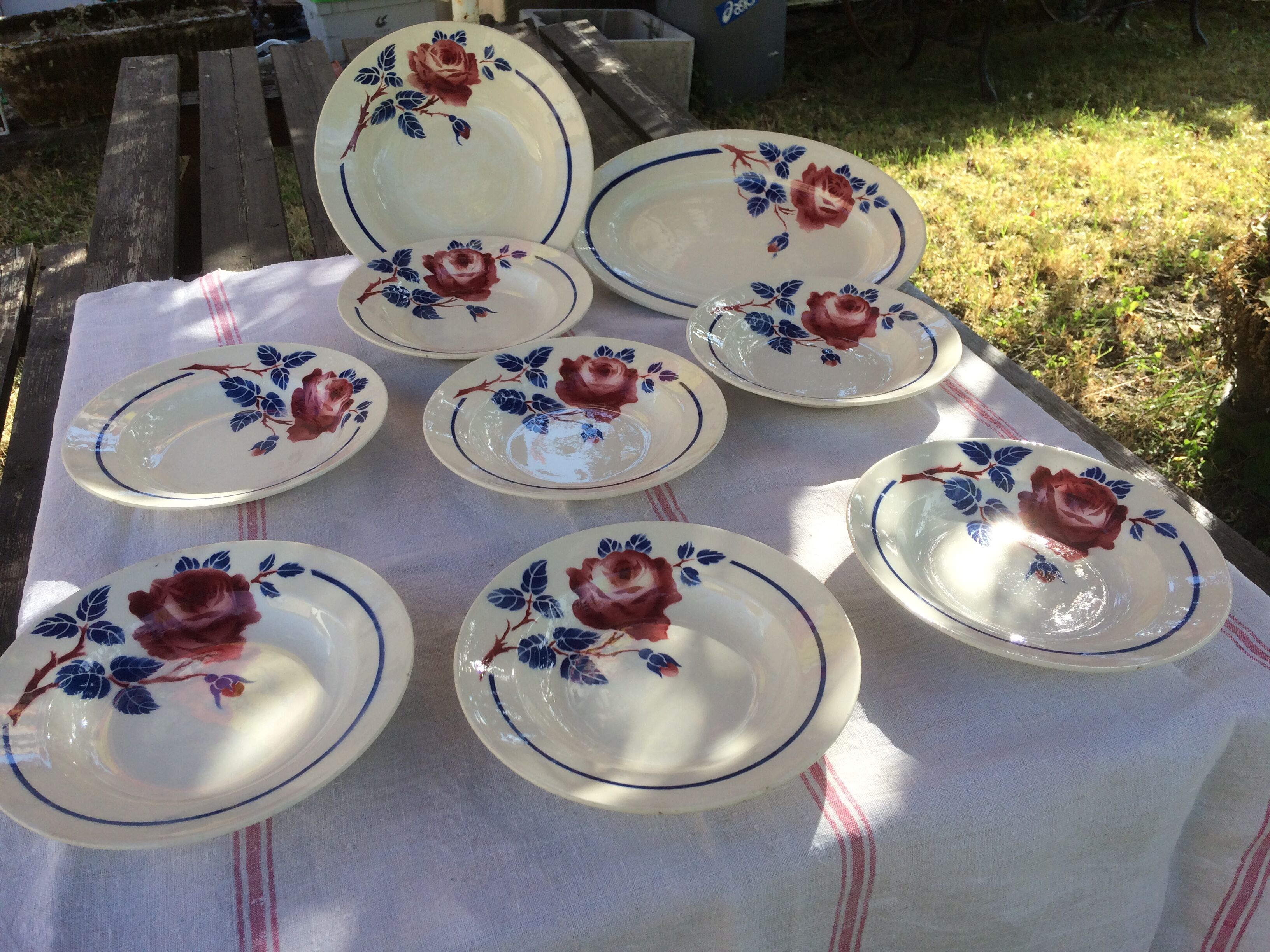 All 7 soup plates, a round deep dish and a flat oval Lunéville