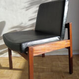 Massive teak and black skai armchair from the 1960s