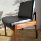Massive teak and black skai armchair from the 1960s