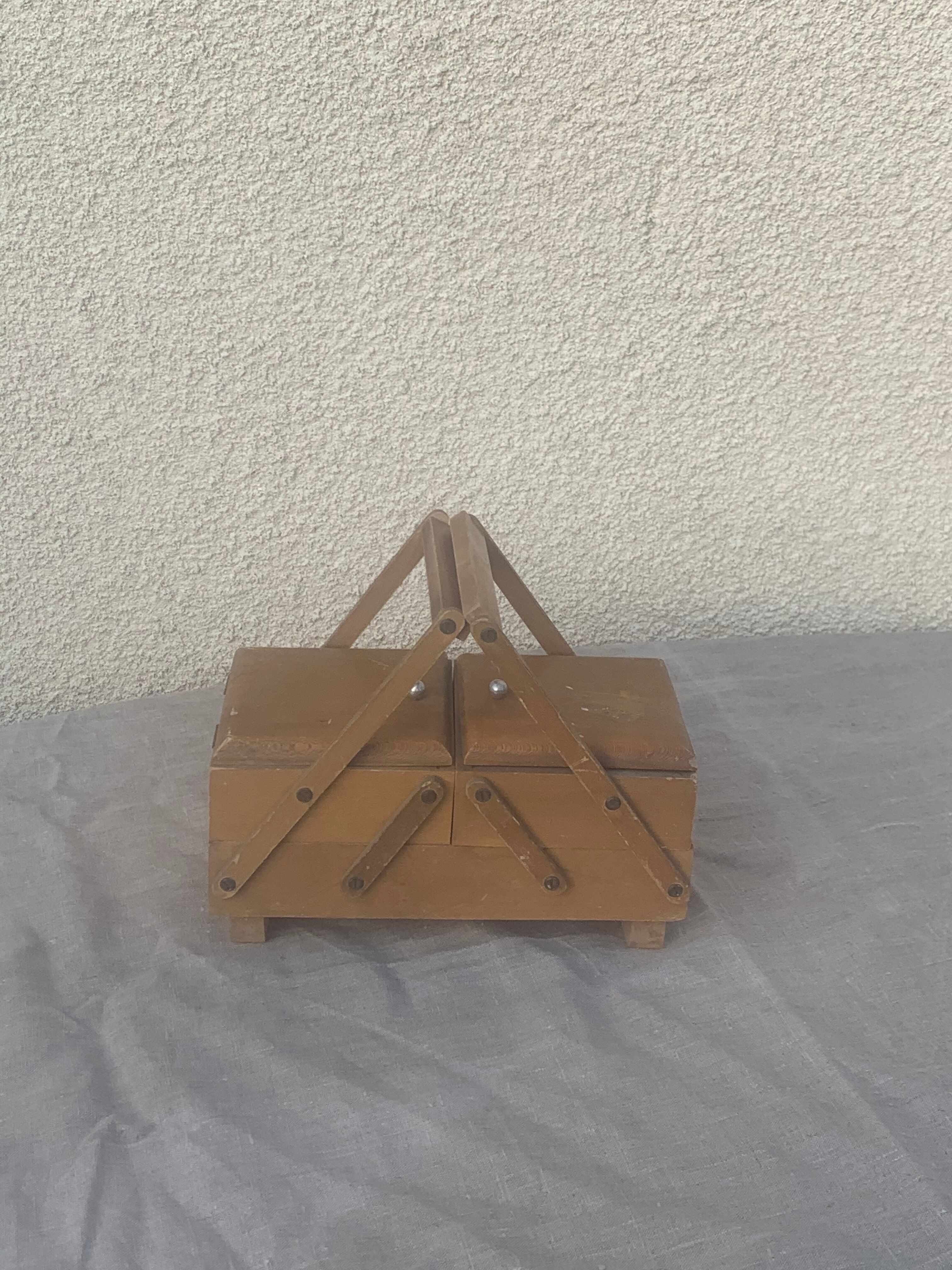 Sewing box in old varnished wood