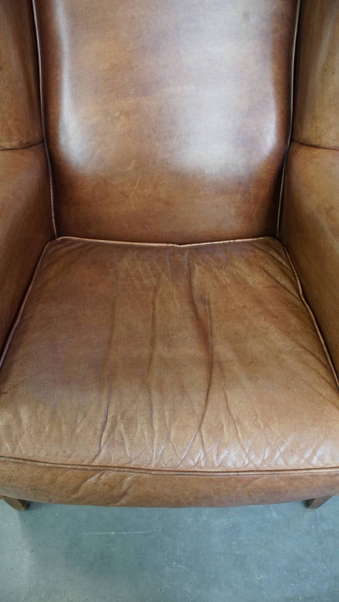 Cowhide Leather Wingback Chair in Light Cognac Color