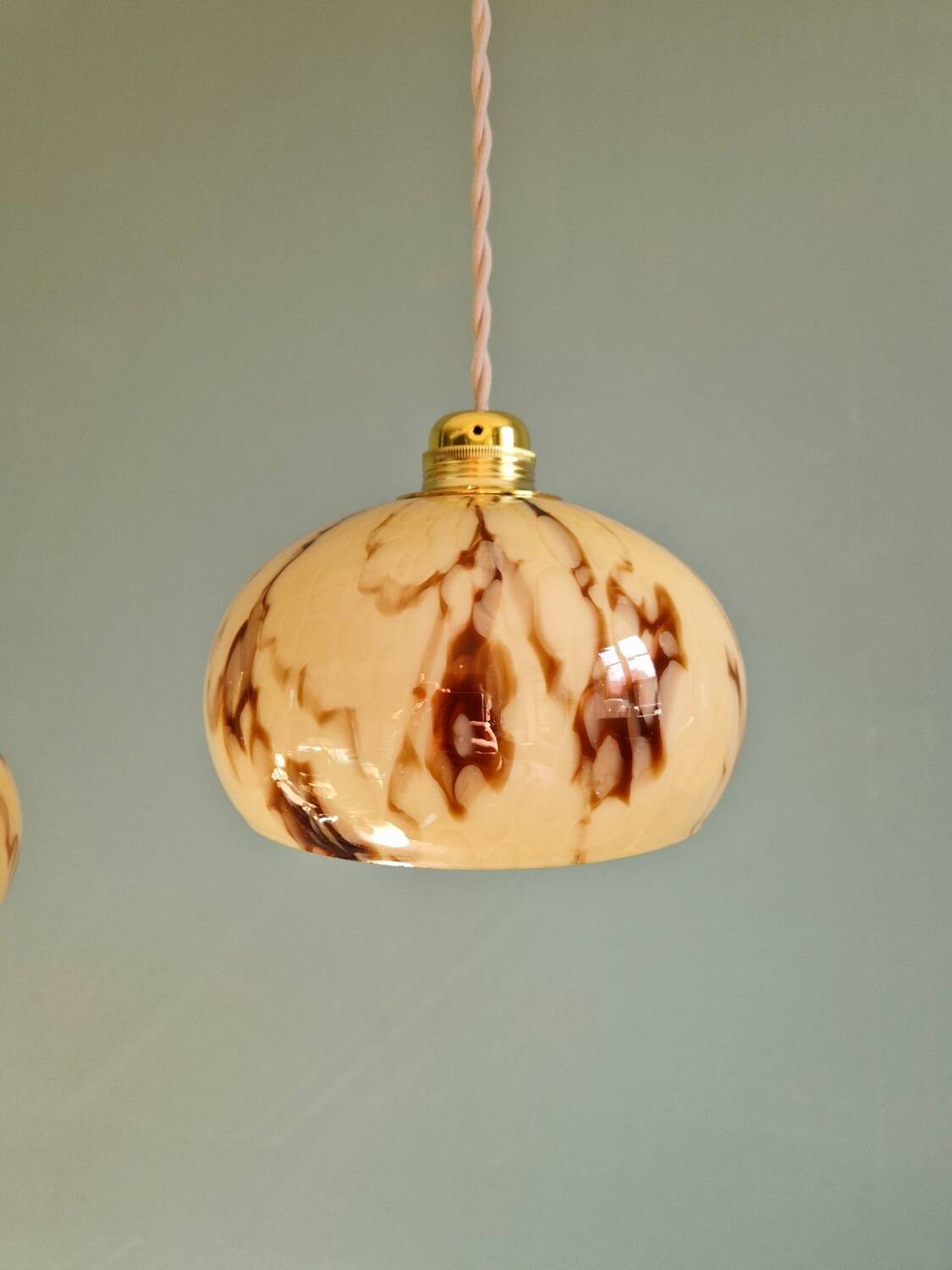 Trio of Art Deco pendant lights in marbled opaline glass, 1920s-30s