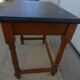 Nightstand or side table in solid wood with a black top.
