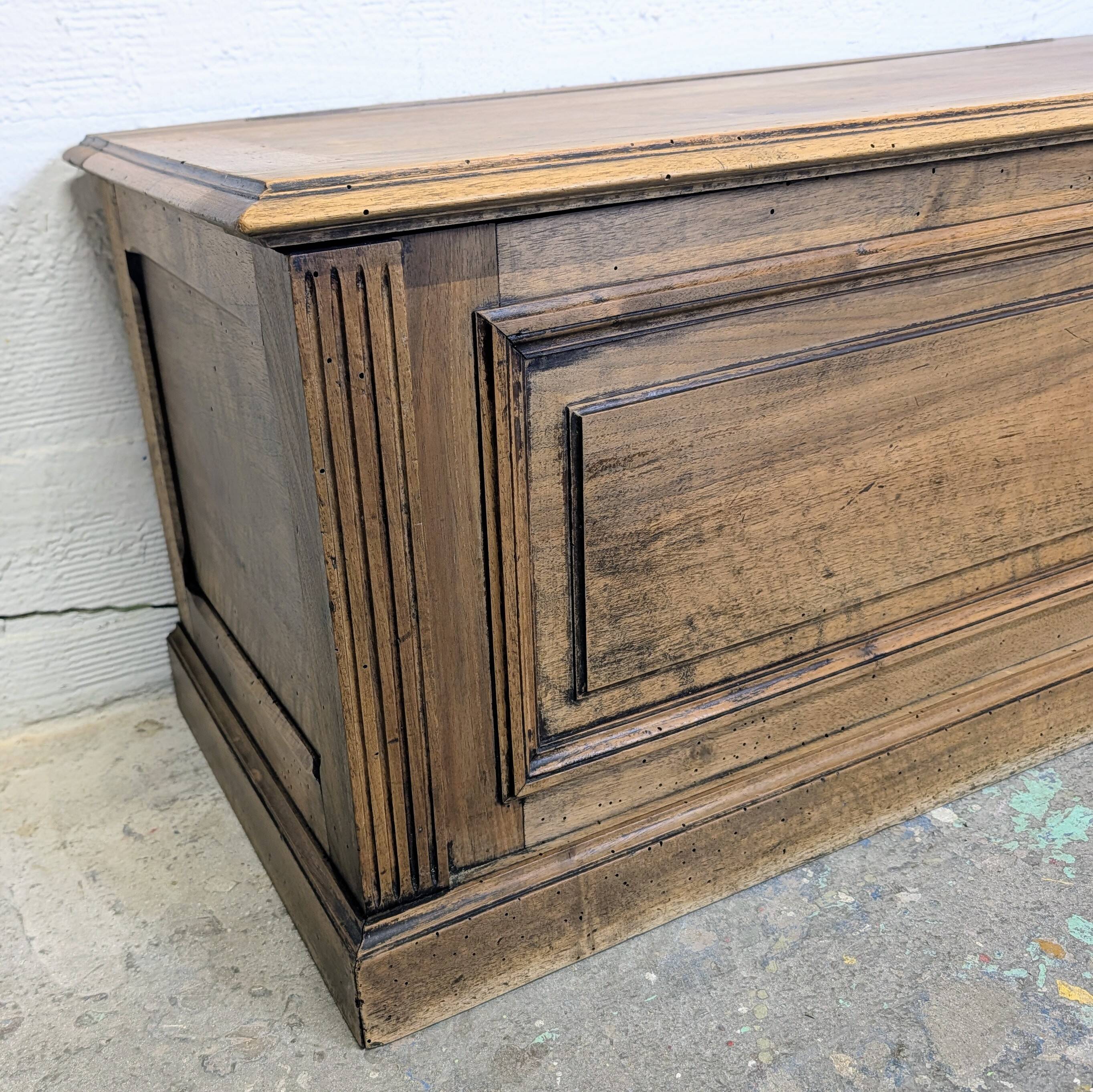 Antique wooden chest with moulded panels