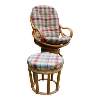 Swivel rattan armchair with its pouf