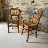 Set of 2 antique wooden and straw chairs.