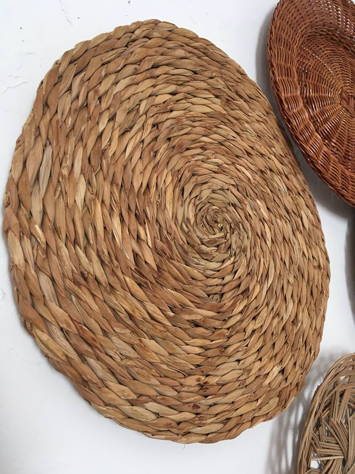 Wall composition of seven baskets and wicker trays