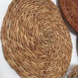 Wall composition of seven baskets and wicker trays