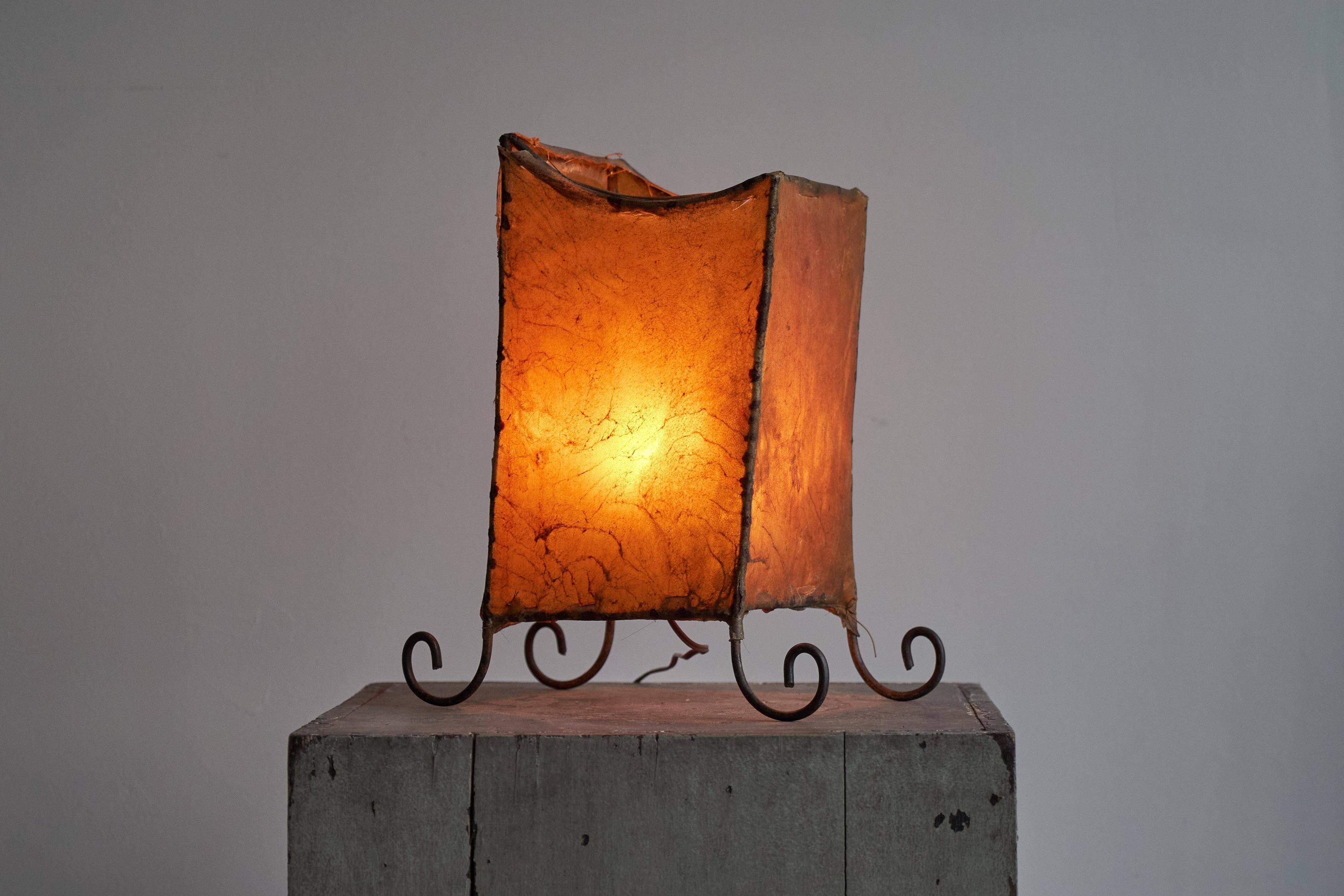 Mid-century table lamp in goat leather and wrought iron, 1950s