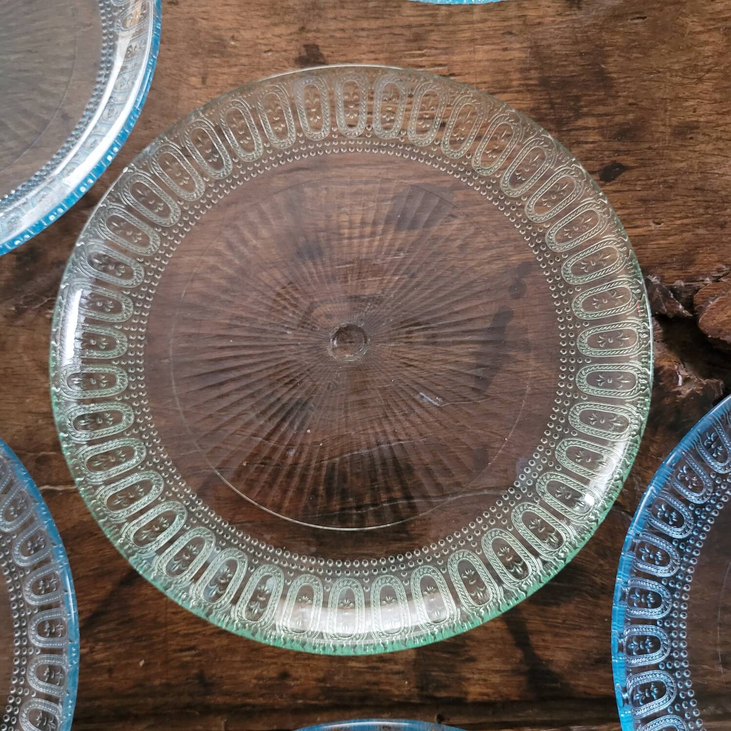 6 molded glass plates – 5 bluish, 1 aqua green