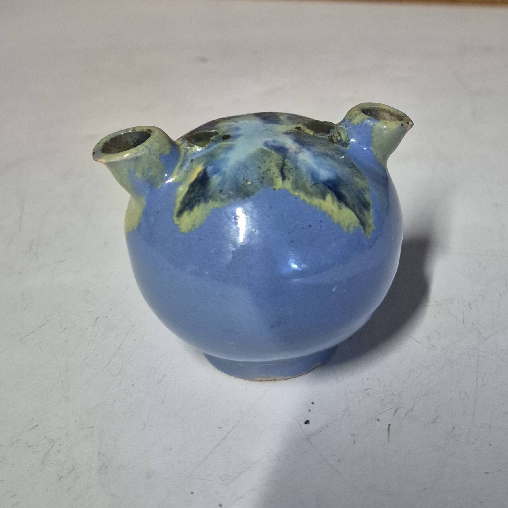 Glazed ceramic flower spike vase stamped "to be defined"