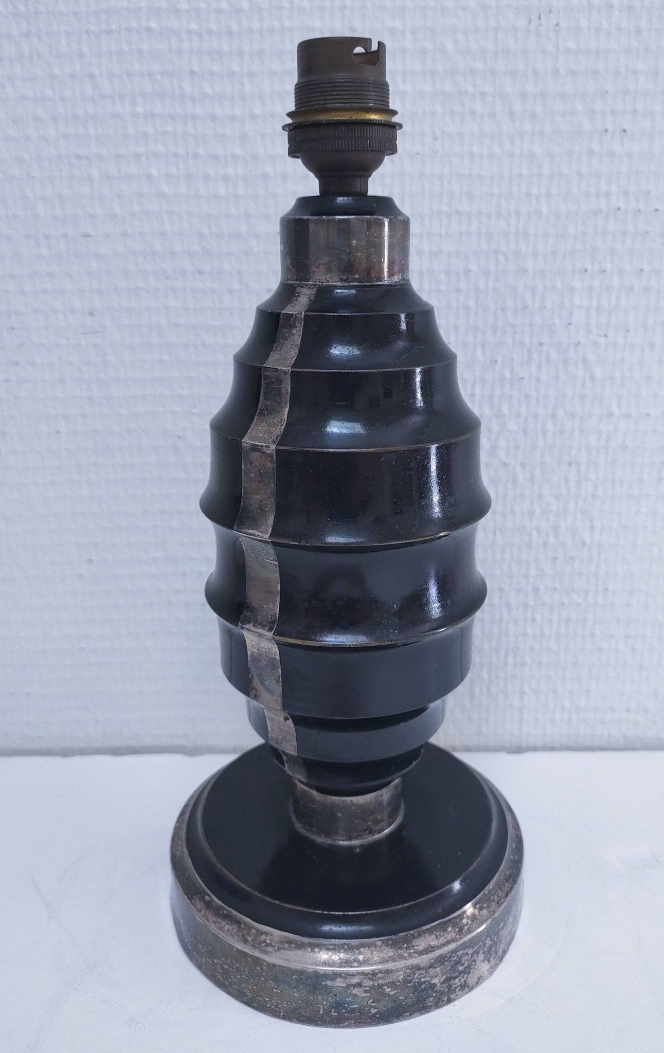 Art Deco metal lamp base with black and silver patina