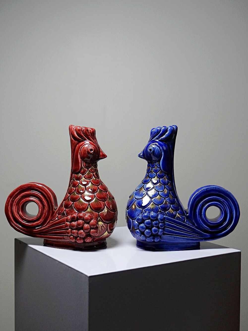Pair of ceramic glazed candlesticks in the shape of roosters, signed A.G Roger, year 1948.