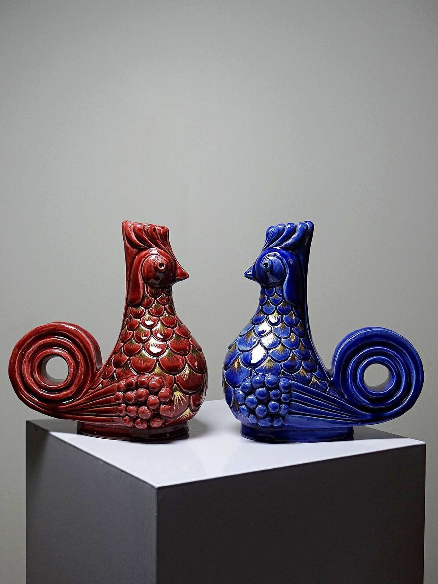 Pair of ceramic glazed candlesticks in the shape of roosters, signed A.G Roger, year 1948.