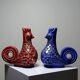 Pair of ceramic glazed candlesticks in the shape of roosters, signed A.G Roger, year 1948.