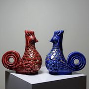 Pair of ceramic glazed candlesticks in the shape of roosters, signed A.G Roger, year 1948.
