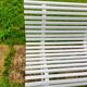 Antique garden bench with metal legs