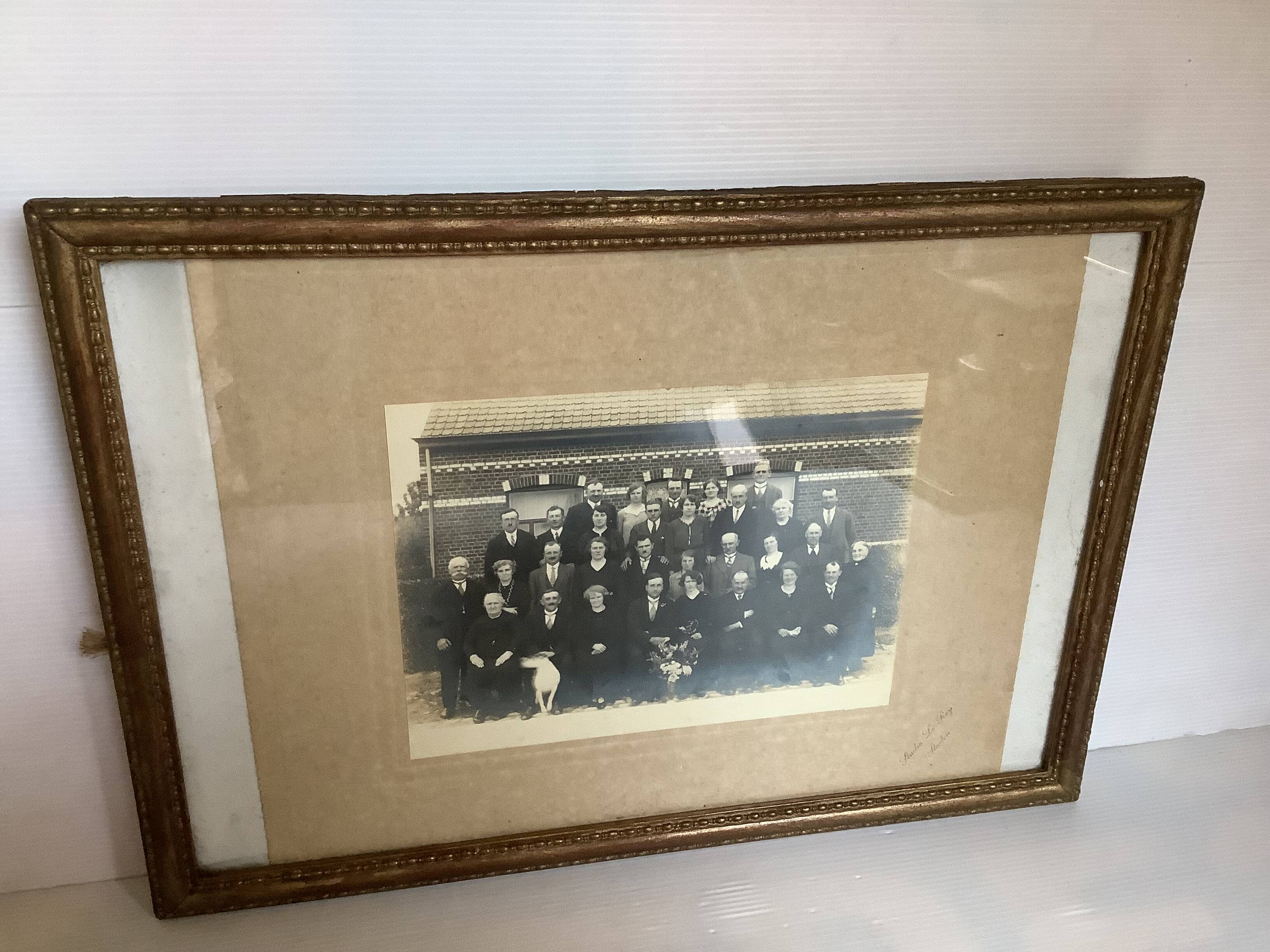 Old photograph of a newlywed couple with a dog