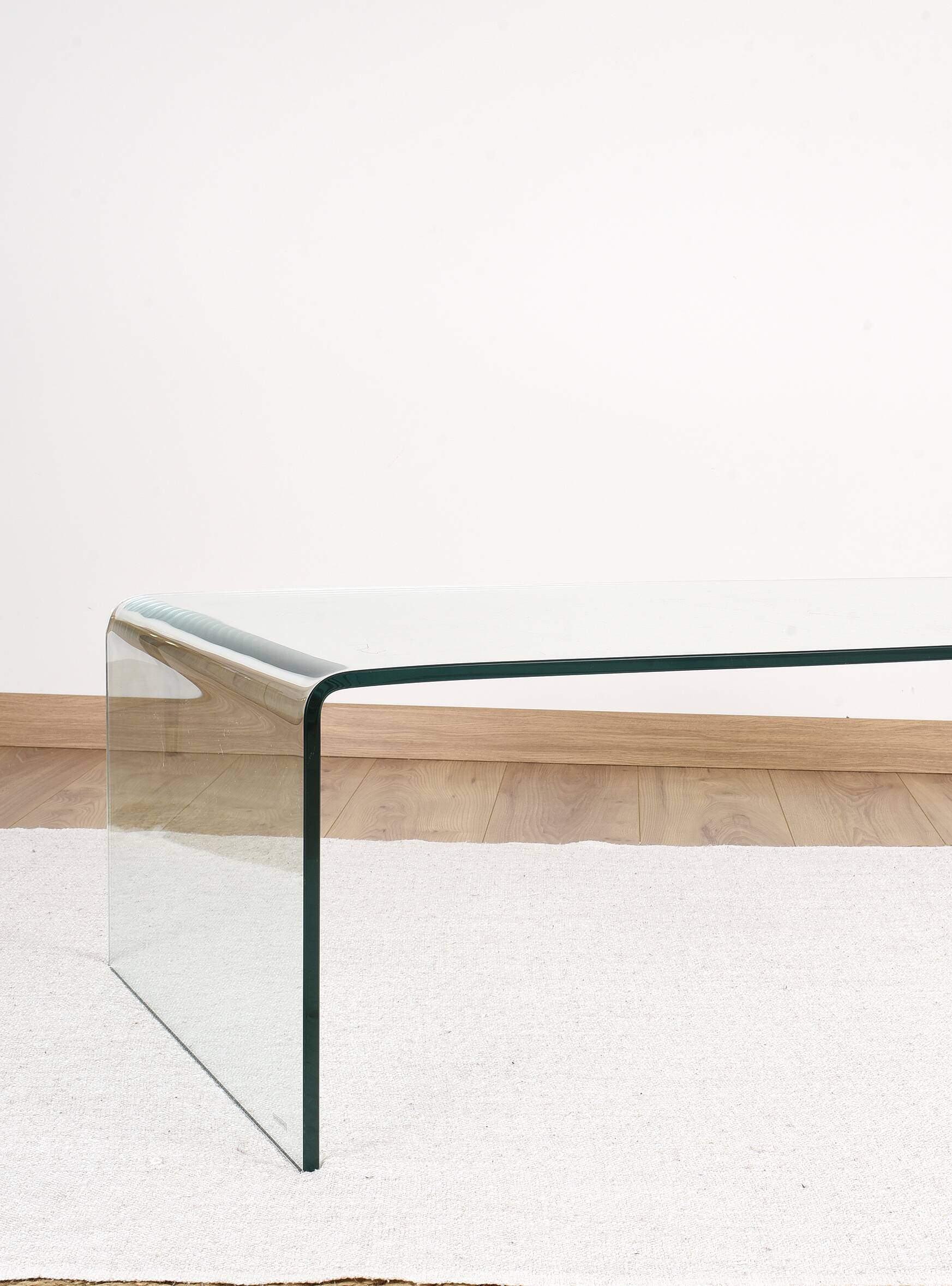 Transparent tempered glass coffee table.