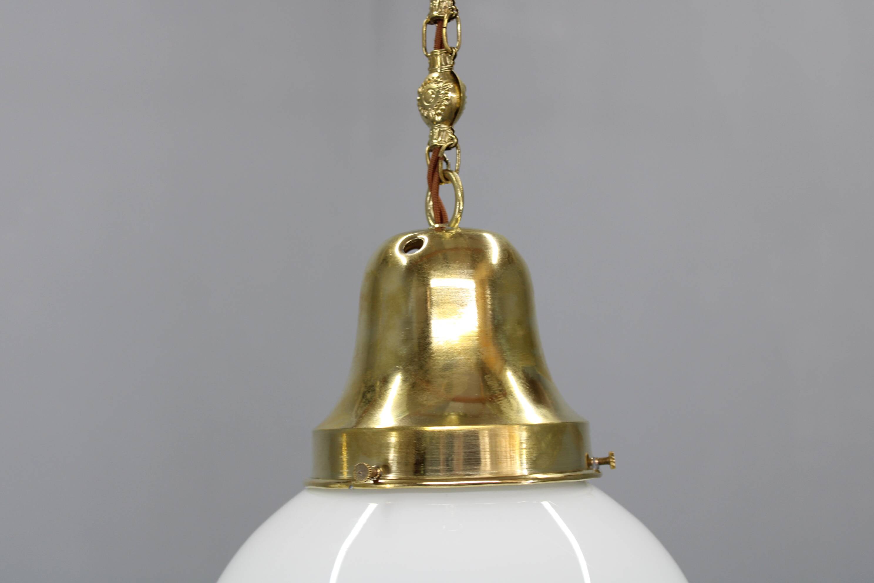Pair of 1930s Peter Behrens Luzette pendants in opaline glass and brass