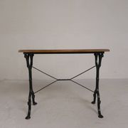 Bistro table with an oak top on a cast iron base, 1930s.