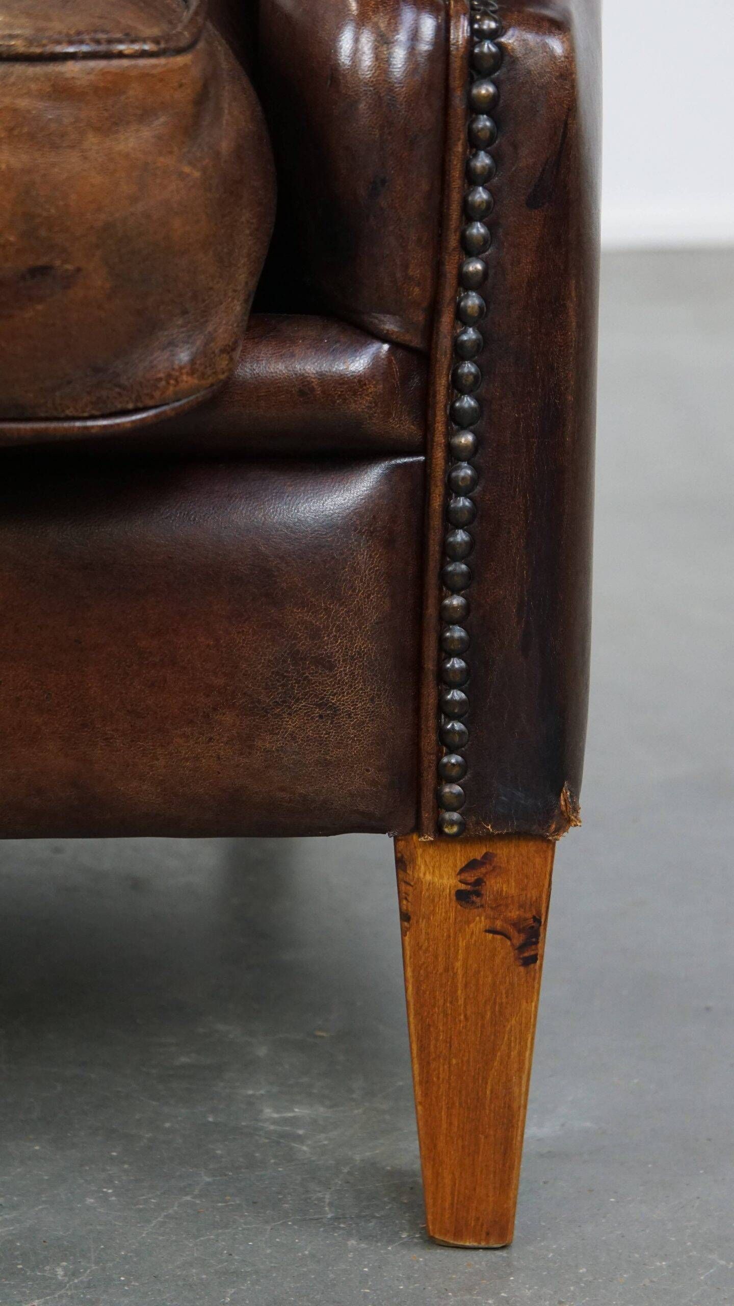 Vintage sheepskin armchair in a dark cognac colour with a comfortable seat
