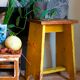 Art-populaire workshop stool in patinated wood
