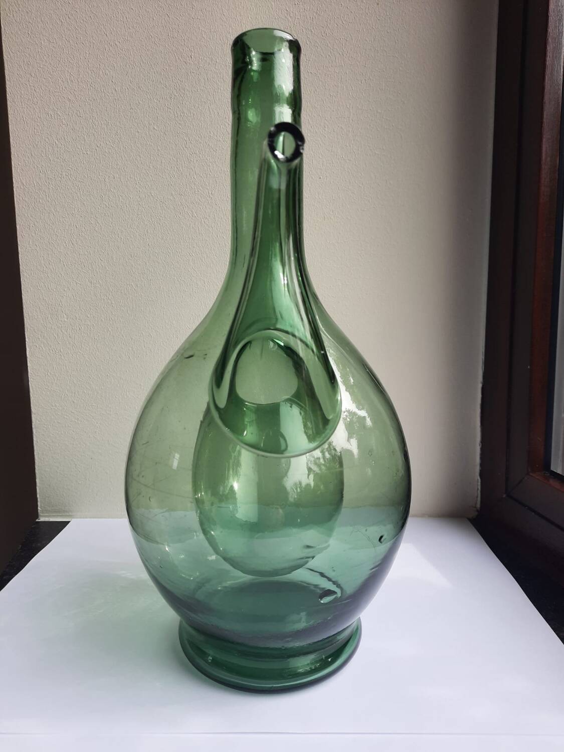 Pair of blown glass wine decanters in blue/green hues.