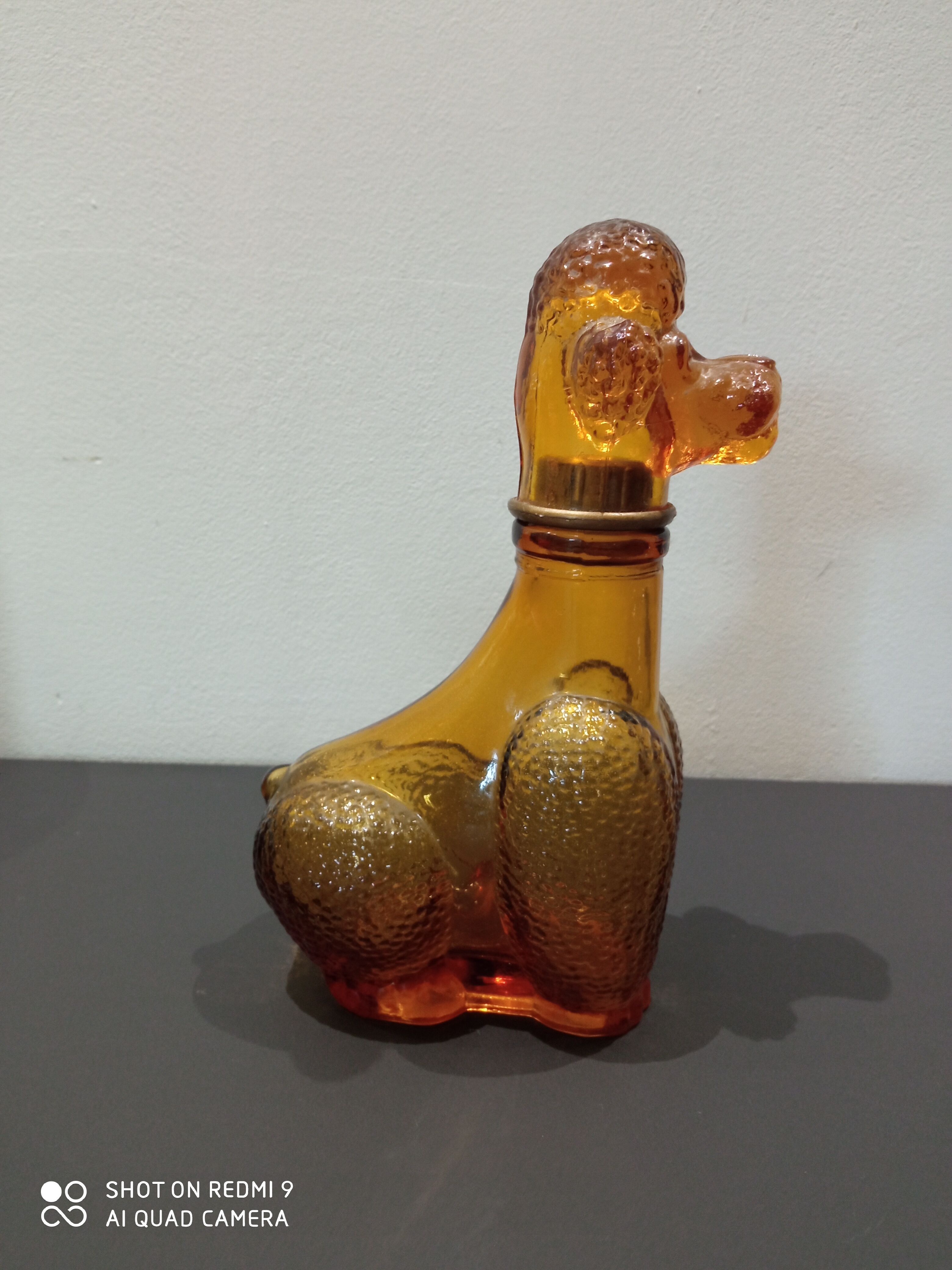Old bottle in amber glass "poodle"