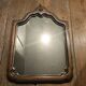 Antique shaped mirror, wood and bronze
