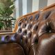 Pair of vintage Chesterfield club armchairs in brown tufted leather –