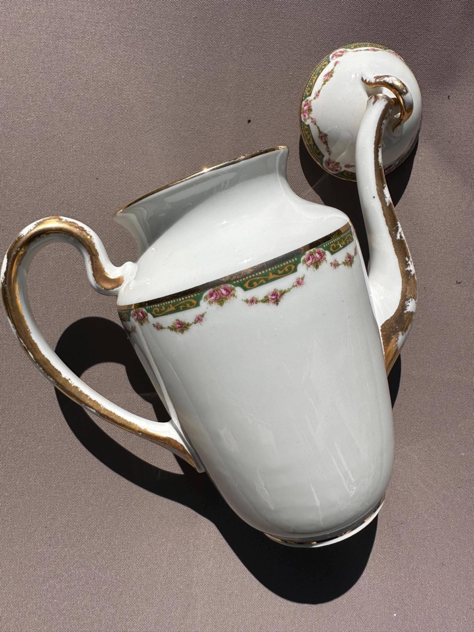 Set of jug, sugar bowl, and milk jug in Limoges porcelain by Paul Past.