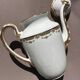 Set of jug, sugar bowl, and milk jug in Limoges porcelain by Paul Past.