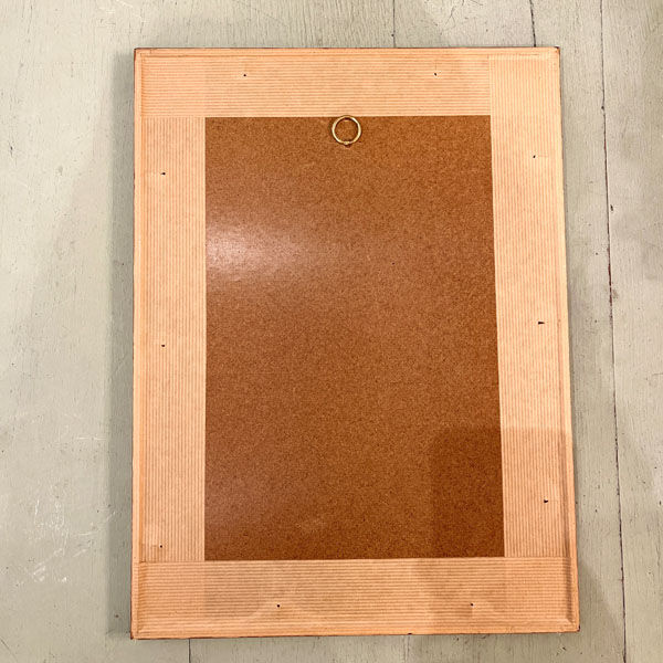 Old board framed under glass, bird