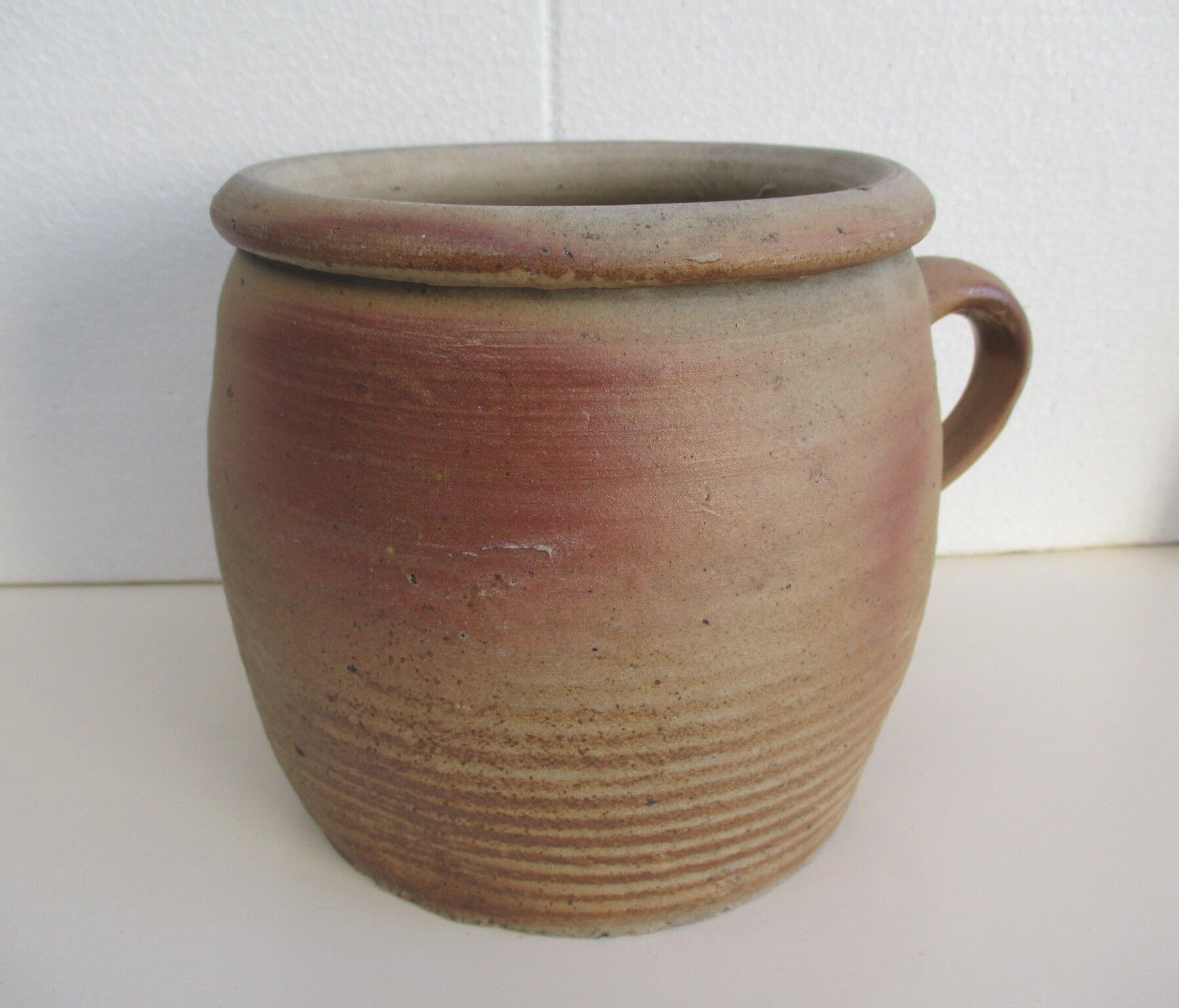 Ancient sandstone pot at one handle