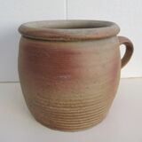 Ancient sandstone pot at one handle