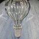 Antique cut glass spirit decanter with silver-plated neck and spout.